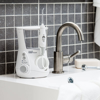 White Aquarius™ water flosser on sink