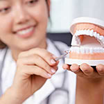 Dental professional demonstrating gum check