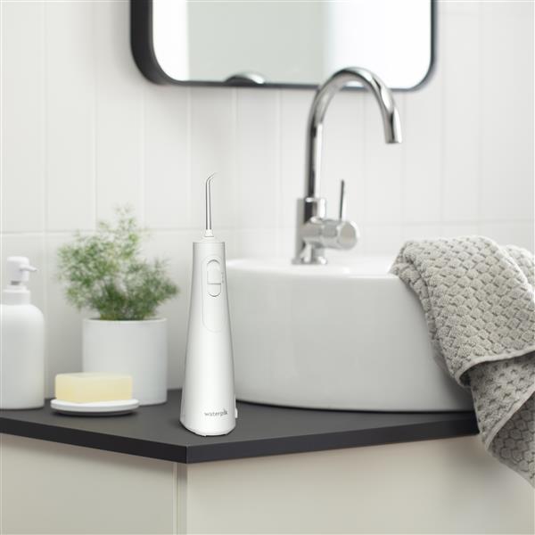 White Cordless Enhance Water Flosser WF-21W010 in Bathroom