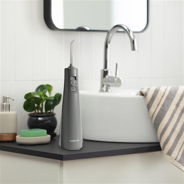 Gray Cordless Pulse Water Flosser WF-20CD017 in Bathroom