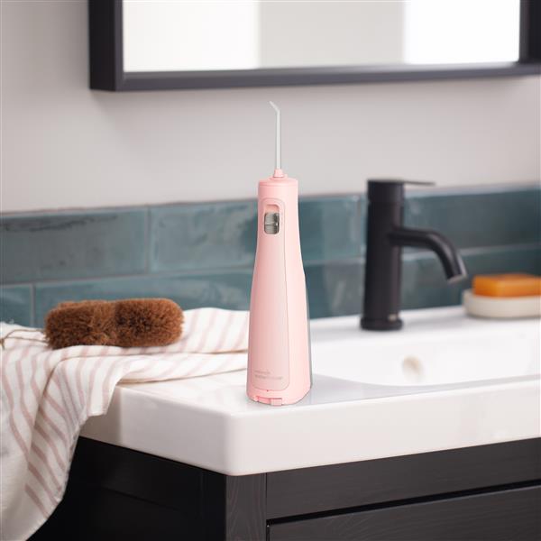 Pink Cordless Revive Water Flosser WF-03 In Bathroom